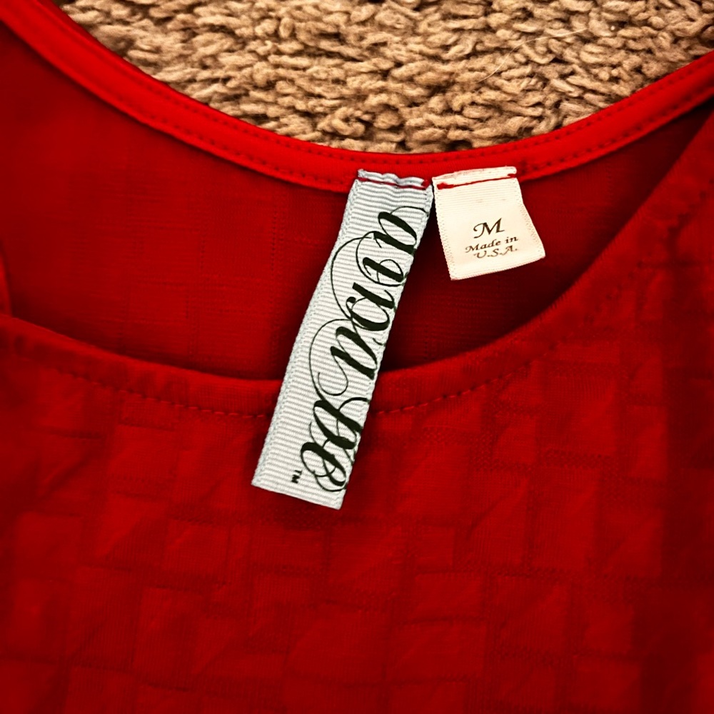 Reddish-pink dress.